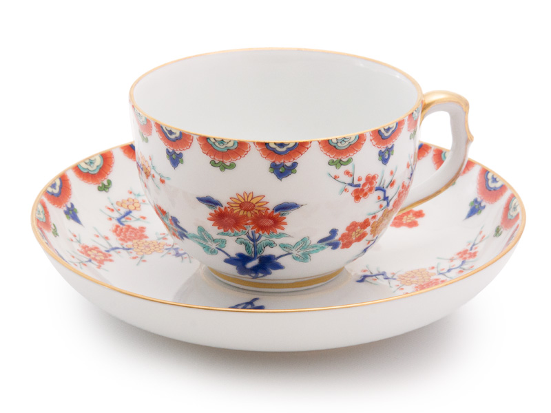 Arita-yaki tea cup and saucer, plum trees and chrysanthemum, Kisen 