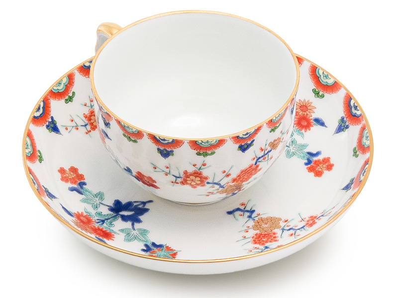 Arita-yaki tea cup and saucer, plum trees and chrysanthemum, Kisen 